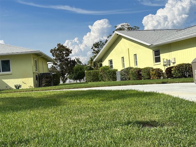 view of property exterior featuring a lawn