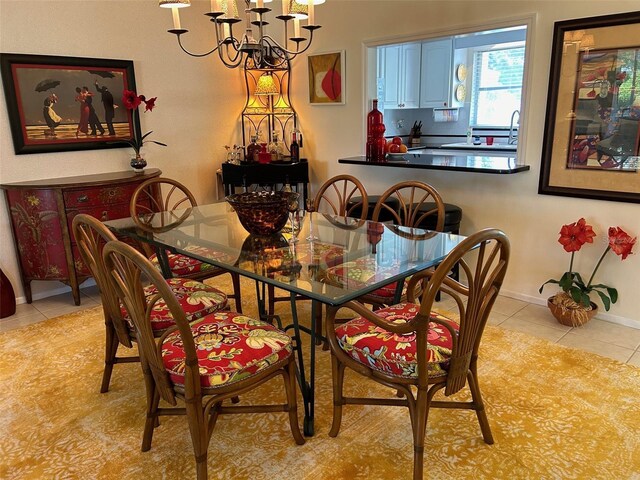 tiled dining space with a notable chandelier