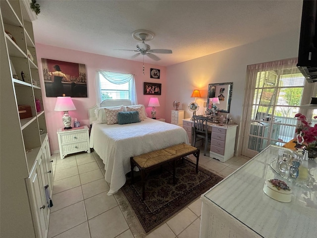 bedroom featuring ceiling fan, multiple windows, and light tile patterned floors