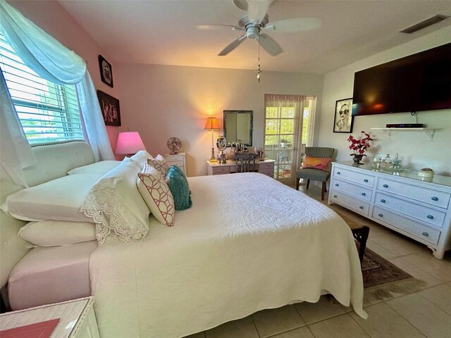 bedroom featuring light tile patterned flooring and ceiling fan