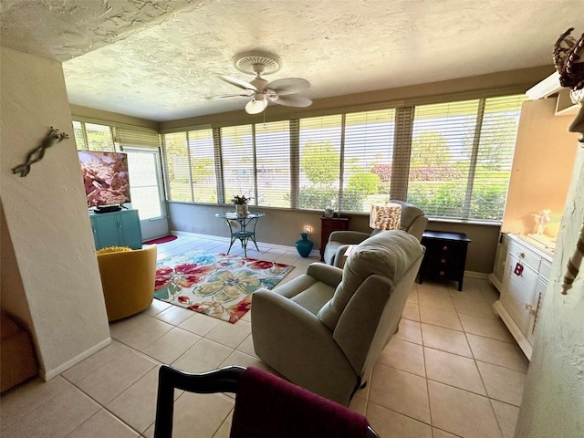 sunroom with ceiling fan