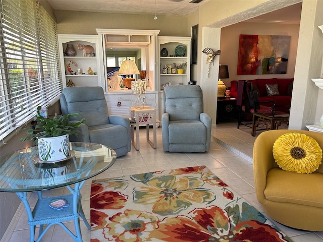 living room featuring light tile patterned floors and crown molding