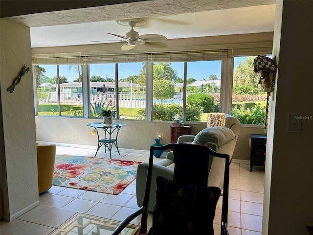 6812 11th Ave W Unit 6812, Bradenton, FL 34209 - sunroom featuring healthy amount of natural light, a textured wall, and tile patterned floors