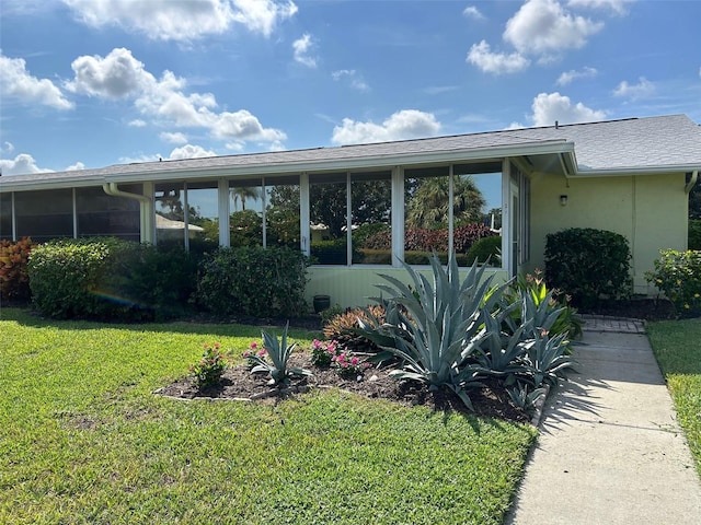 6812 11th Ave W Unit 6812, Bradenton, FL 34209 - view of front of property featuring a sunroom and a front lawn