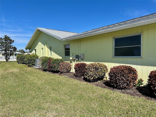 6812 11th Ave W Unit 6812, Bradenton, FL 34209 - view of property exterior featuring a yard and a shingled roof