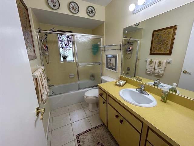 6812 11th Ave W Unit 6812, Bradenton, FL 34209 - full bathroom featuring vanity, shower / bath combination with glass door, and tile patterned floors