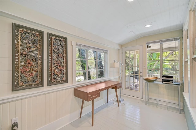 sunroom / solarium featuring french doors, a healthy amount of sunlight, and lofted ceiling