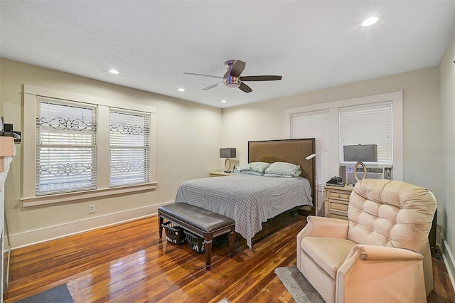 bedroom featuring ceiling fan, cooling unit, and dark hardwood / wood-style flooring