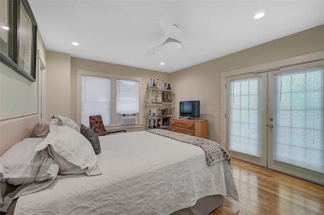 bedroom featuring access to exterior, light hardwood / wood-style flooring, ceiling fan, and cooling unit