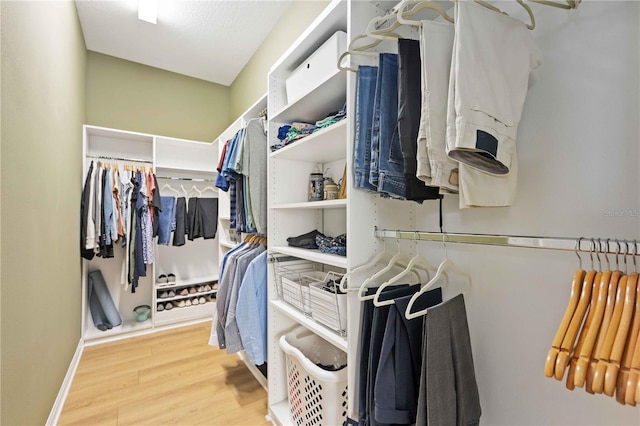 spacious closet featuring hardwood / wood-style flooring