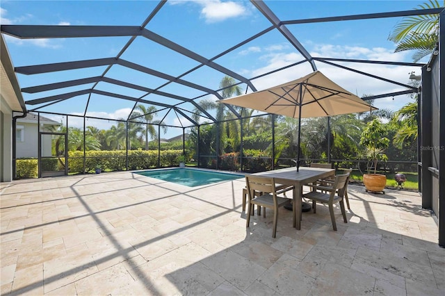 view of pool with glass enclosure and a patio