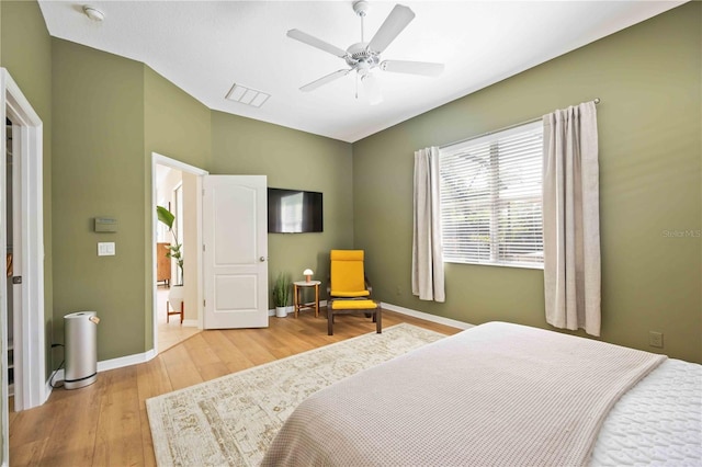 bedroom featuring ceiling fan and light hardwood / wood-style flooring