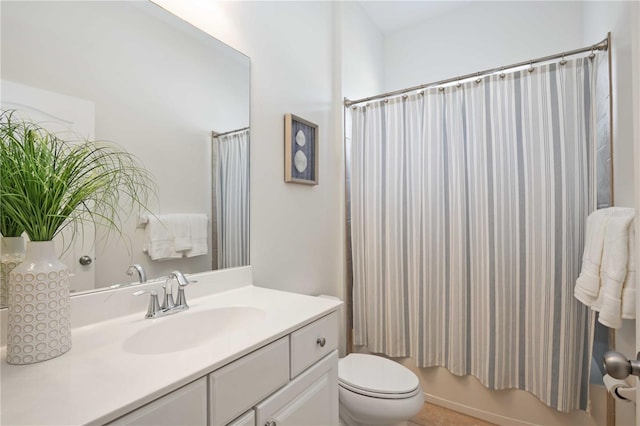 full bathroom with toilet, vanity, and shower / tub combo with curtain