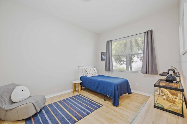 bedroom with wood-type flooring