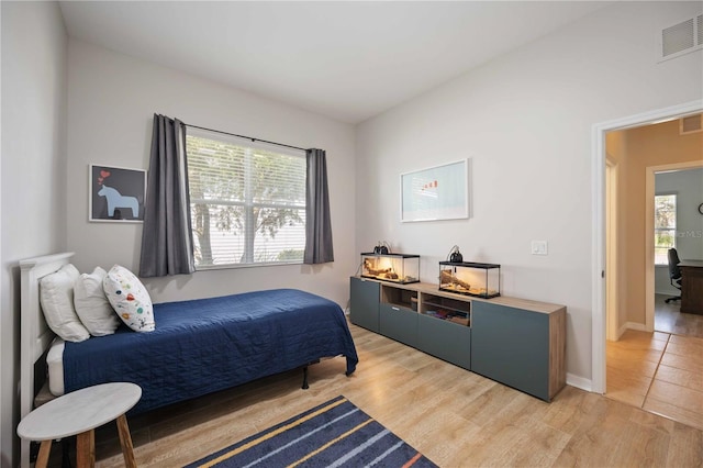 bedroom with light hardwood / wood-style floors