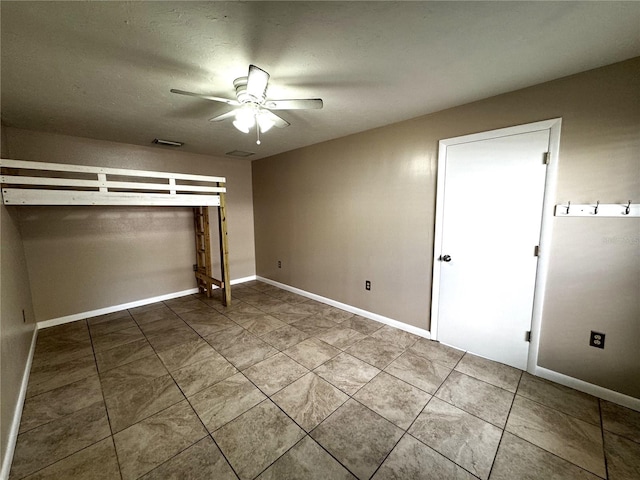 unfurnished bedroom featuring ceiling fan