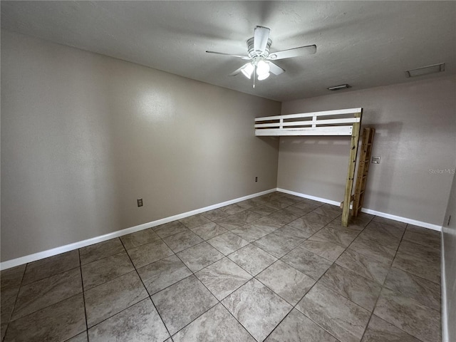 unfurnished bedroom featuring ceiling fan