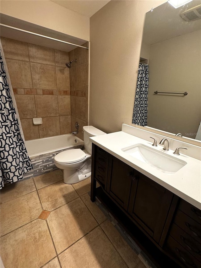 full bathroom featuring shower / tub combo with curtain, vanity, toilet, and tile patterned flooring