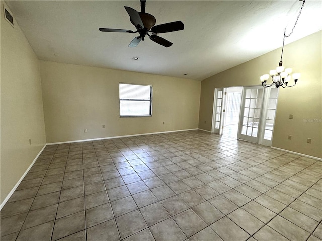 empty room featuring vaulted ceiling, light tile patterned floors, and ceiling fan with notable chandelier