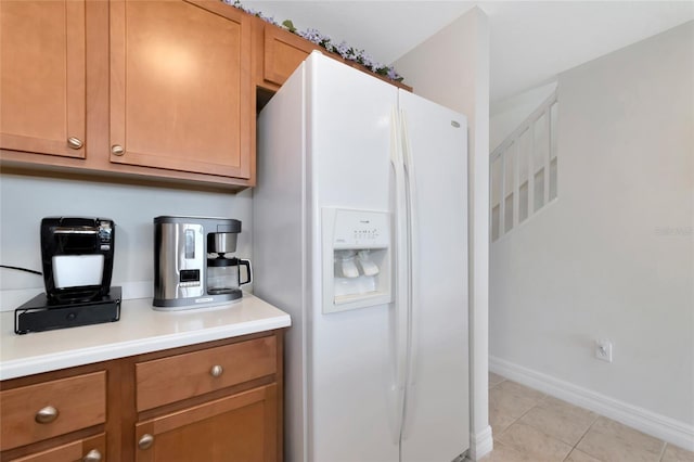 553 Bahia Beach Blvd, Ruskin, FL 33570 - kitchen with white fridge with ice dispenser and light tile patterned floors