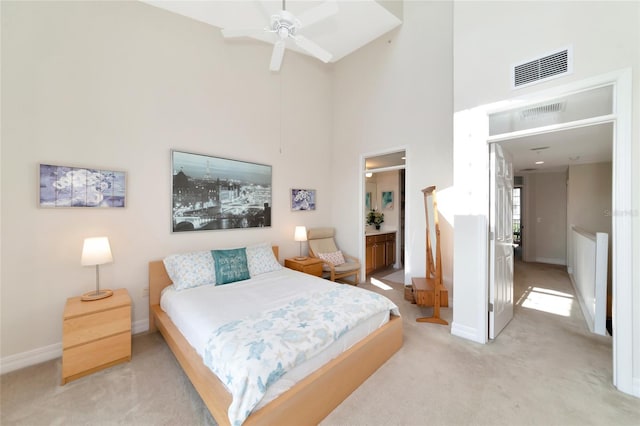 553 Bahia Beach Blvd, Ruskin, FL 33570 - carpeted bedroom featuring a towering ceiling, ceiling fan, and ensuite bathroom
