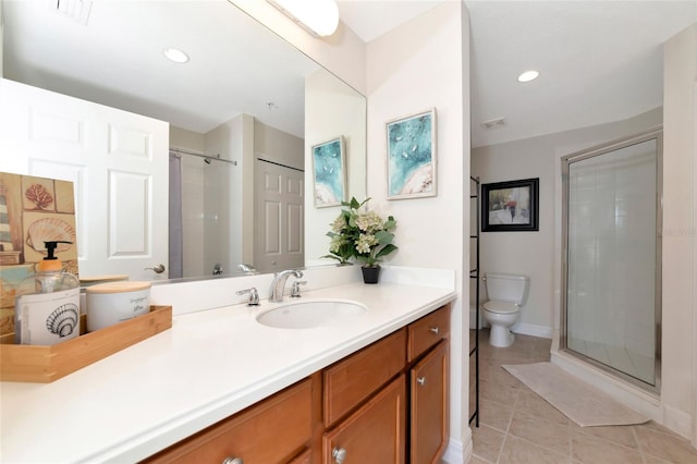 553 Bahia Beach Blvd, Ruskin, FL 33570 - bathroom with tile patterned flooring, vanity, toilet, and a shower with door