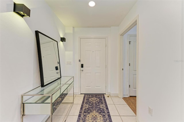 hallway featuring light tile patterned flooring