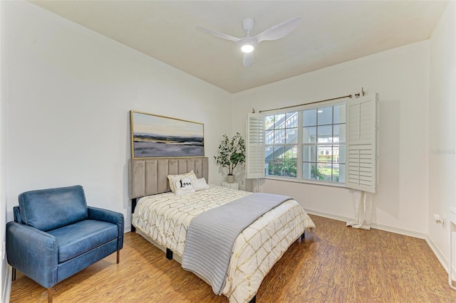 bedroom featuring hardwood / wood-style floors and ceiling fan