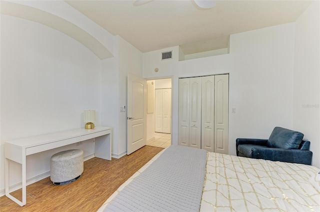 bedroom with a closet and light wood-type flooring