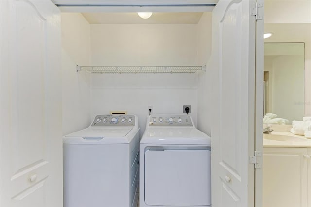 laundry area with sink and separate washer and dryer