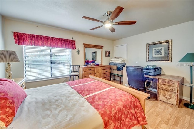 bedroom featuring ceiling fan and light hardwood / wood-style flooring