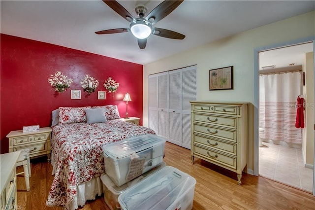 bedroom featuring a closet, light wood-type flooring, and ceiling fan