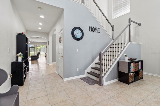 stairway with tile patterned flooring