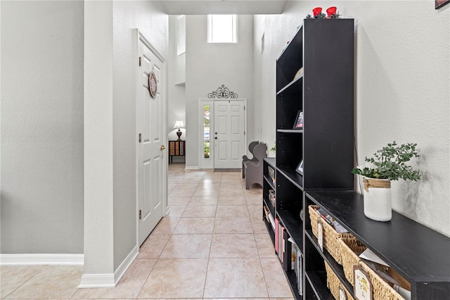 hallway with light tile patterned flooring