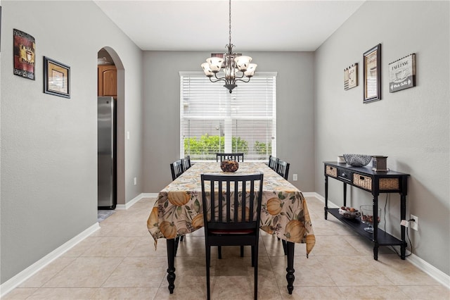 dining room featuring a chandelier and light tile patterned floors