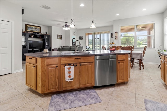 kitchen featuring hanging light fixtures, an island with sink, dishwasher, ceiling fan, and sink