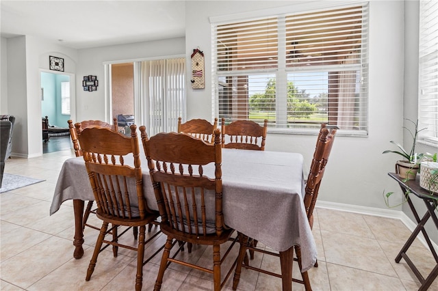 dining area with light tile patterned floors