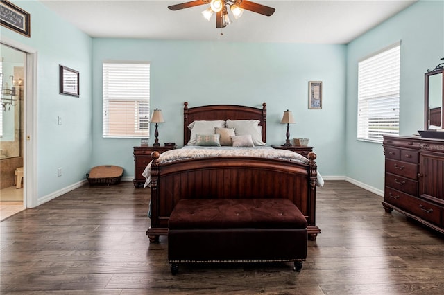 bedroom featuring ceiling fan, dark hardwood / wood-style floors, and ensuite bathroom