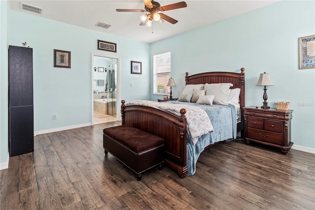 bedroom with ceiling fan, ensuite bath, and dark wood-type flooring