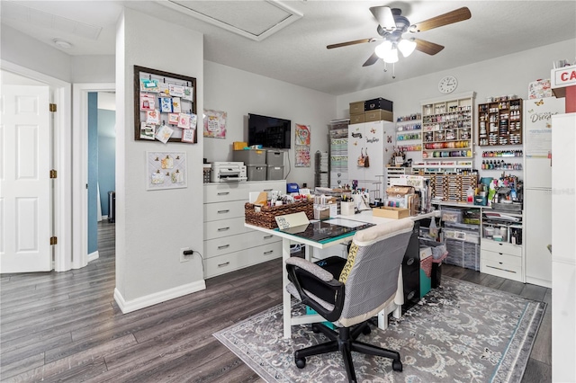 office space with dark hardwood / wood-style flooring and ceiling fan