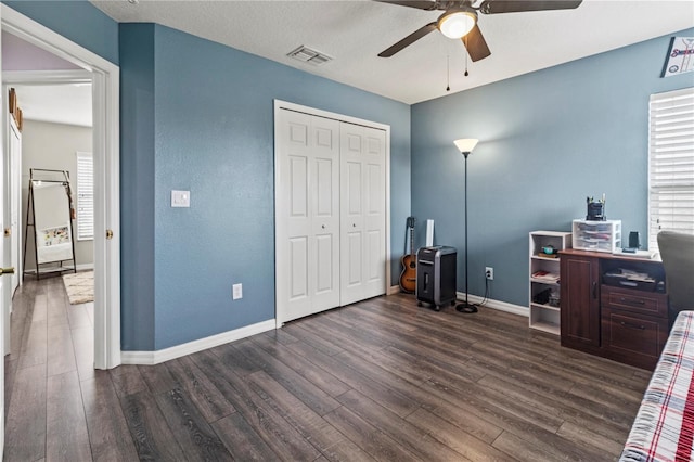 office space featuring ceiling fan, a textured ceiling, and dark wood-type flooring