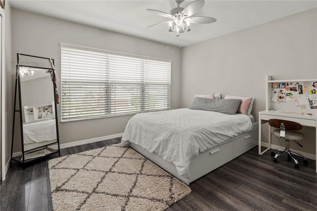 bedroom with ceiling fan and dark hardwood / wood-style flooring