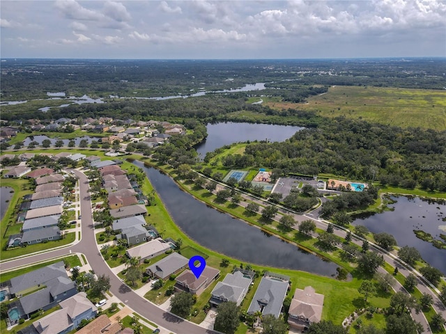 birds eye view of property with a water view