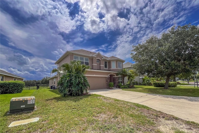 view of front of home featuring a front yard and a garage