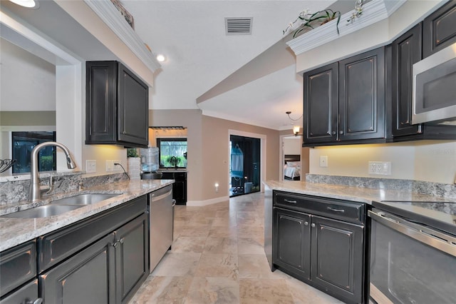 kitchen with stainless steel appliances, sink, and ornamental molding