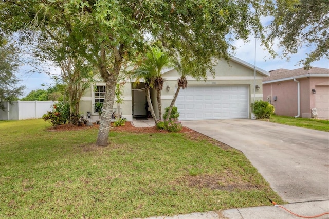 view of front of house with a garage and a front lawn