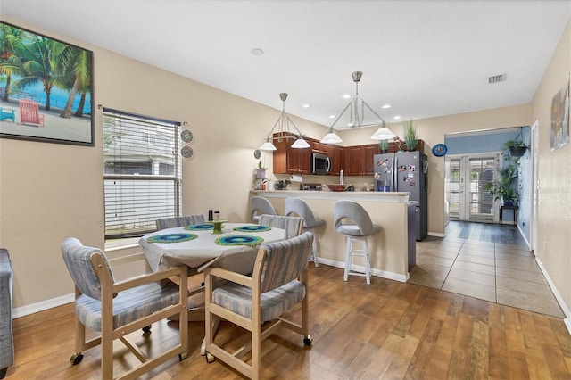 dining area featuring light wood-type flooring