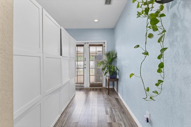 hallway with dark hardwood / wood-style floors