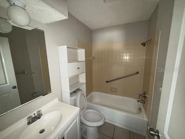 bathroom with shower / bathing tub combination, vanity, toilet, and tile patterned floors