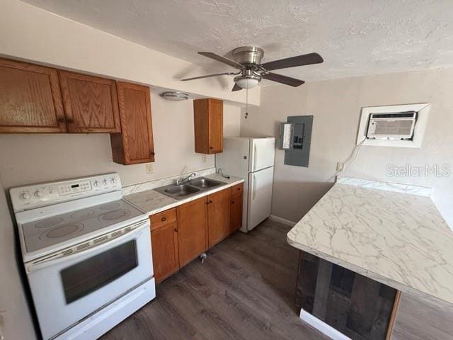 kitchen with light countertops, white appliances, a sink, and electric panel